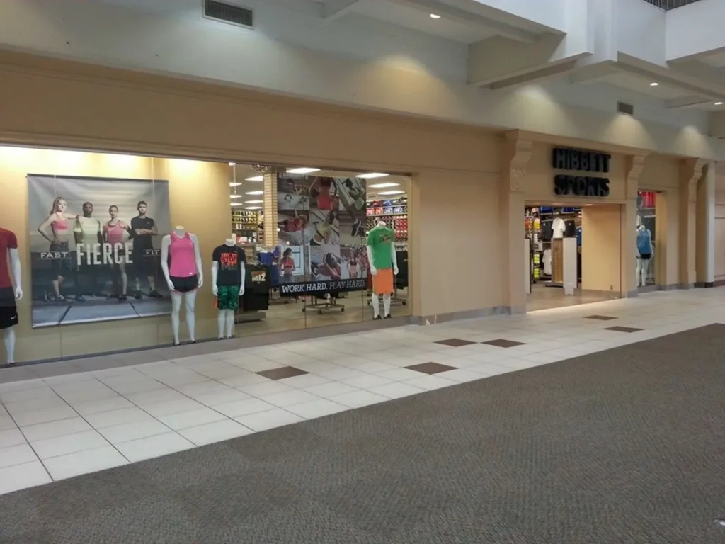 A bustling shopping mall with people walking around, located at Alton Square Mall.