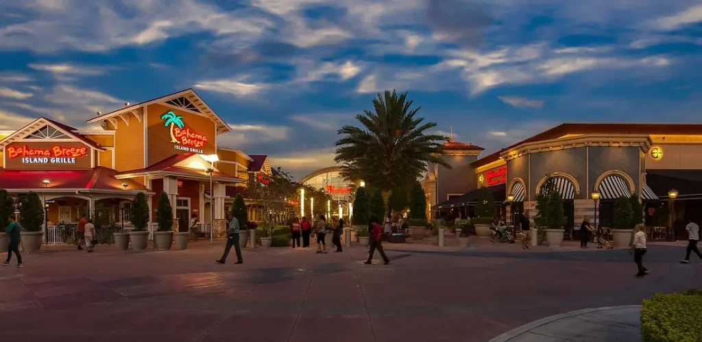 Brandon Mall at sunset, bustling with people walking around, enjoying their shopping experience.