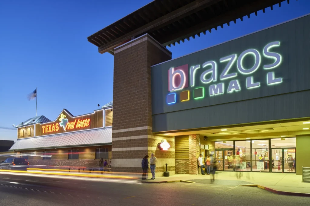 Exterior of a store at Brazos Mall, showcasing a variety of shops and a vibrant atmosphere.