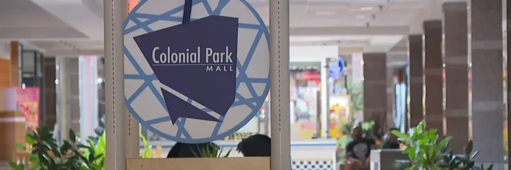 Central sign at Colonial Park Mall, shopping vibe.