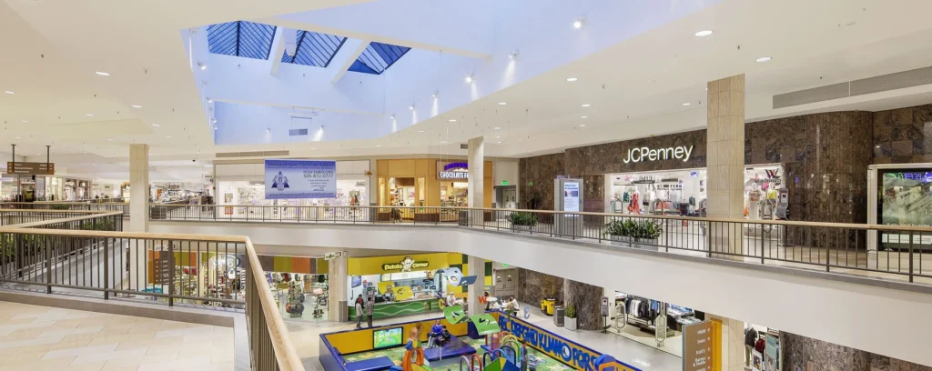 A mall with a spacious indoor play area and a skylight, located at Coronado Center.