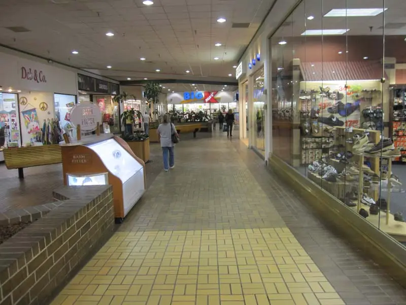 Step onto the inviting brick floor as you enter Jasper Mall, where tradition meets modern shopping in style.