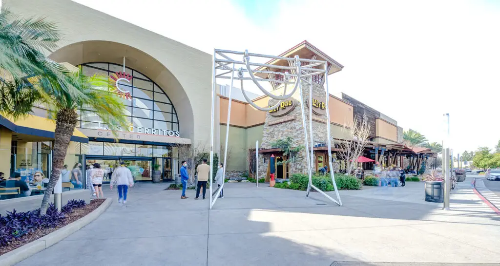 Urban shopping center featuring a grand waterfall as the focal point within the building.