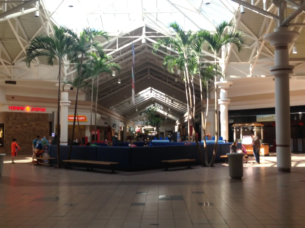 Interior of Midland Mall, showcasing various stores and shoppers.