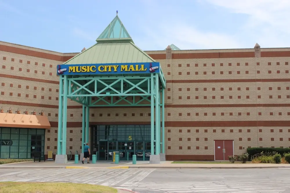 A tan building at Music City Mall.