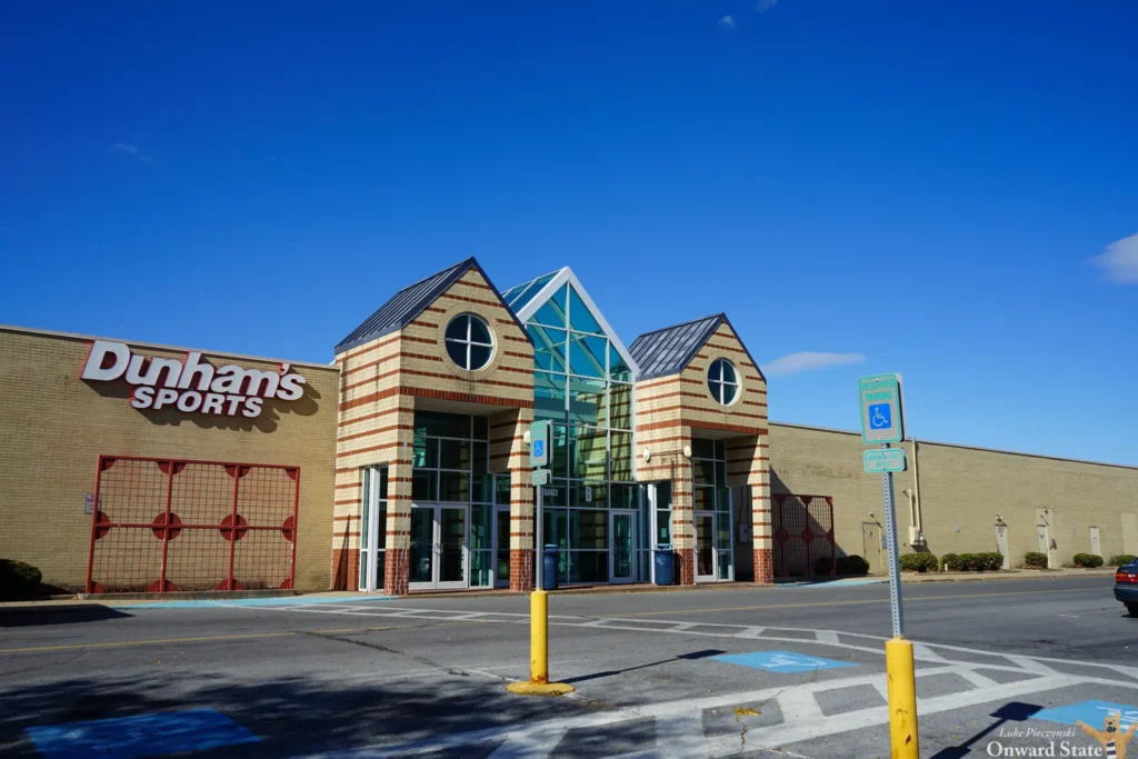 Experience the lively Dunn's store in Charlotte, NC! This mall entrance invites you to explore its vibrant ambiance and indulge in a shopping spree.