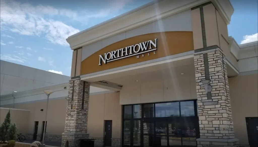 Exterior of Northtown Mall with people walking in and out of the entrance.