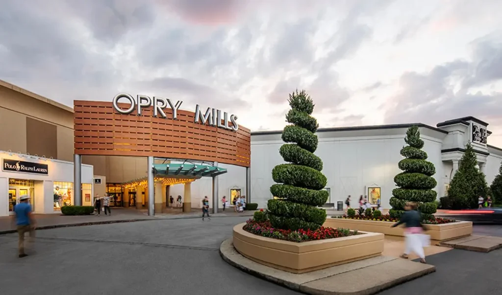 Exterior of Opry Mills shopping center at dusk.