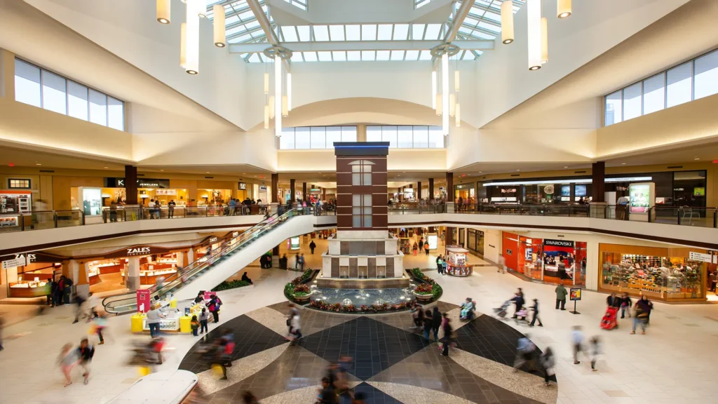 A bustling shopping mall, Orland Square, filled with people strolling around and enjoying their shopping experience.