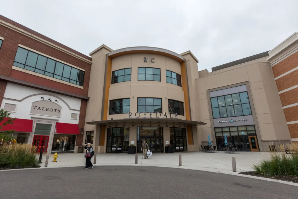 Exterior of Rosedale Center with shoppers walking around the mall.