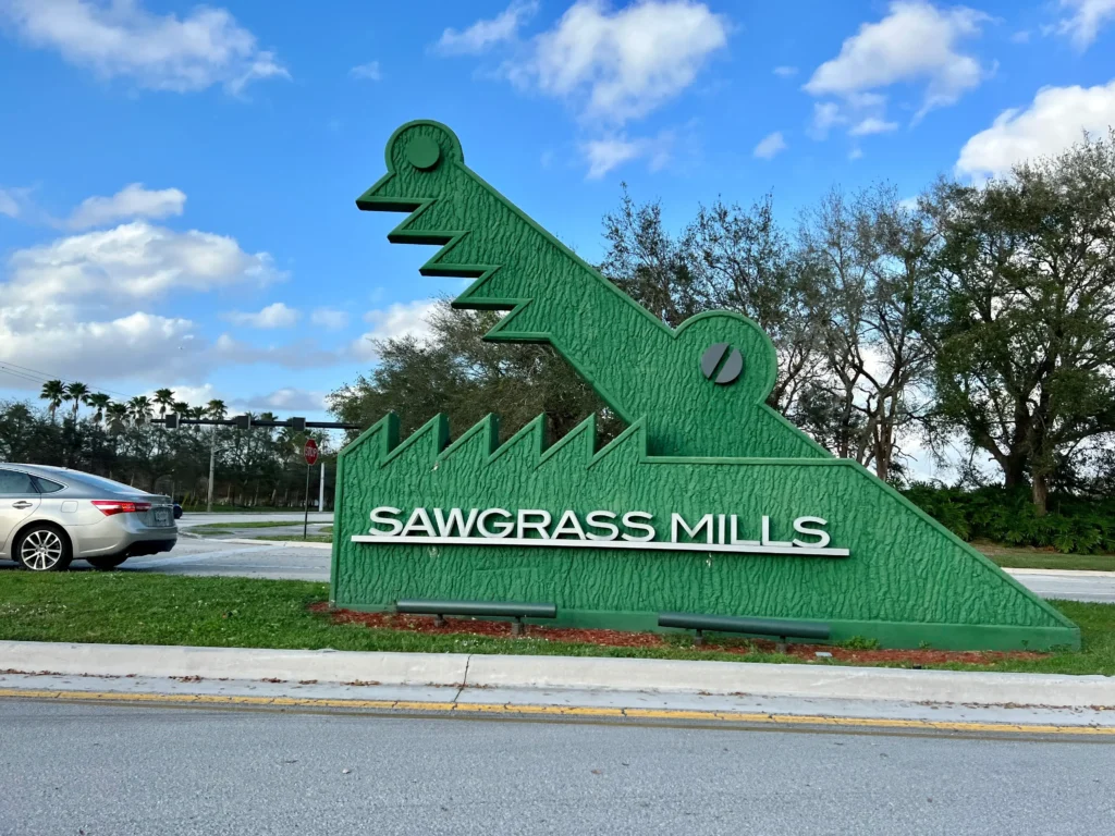 A view of Sawgrass Mills Mall in Florida, showcasing a bustling shopping center with various stores and vibrant atmosphere.