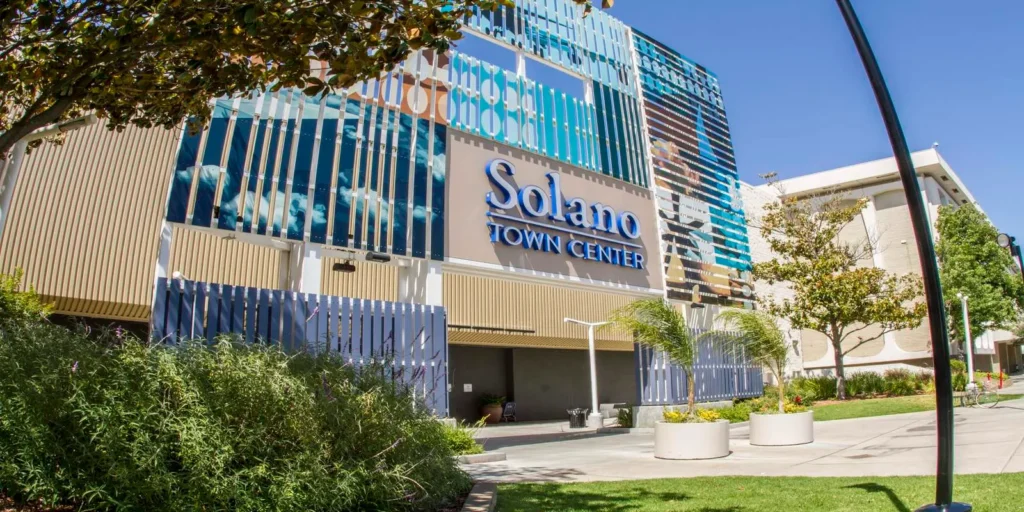 Exterior of Solano Town Center, a bustling shopping destination with modern architecture and vibrant atmosphere.