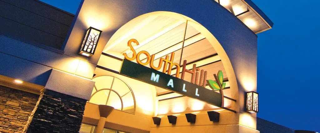 A sign reading "Southern Hills Mall" on a large building, known as South Hill Mall.