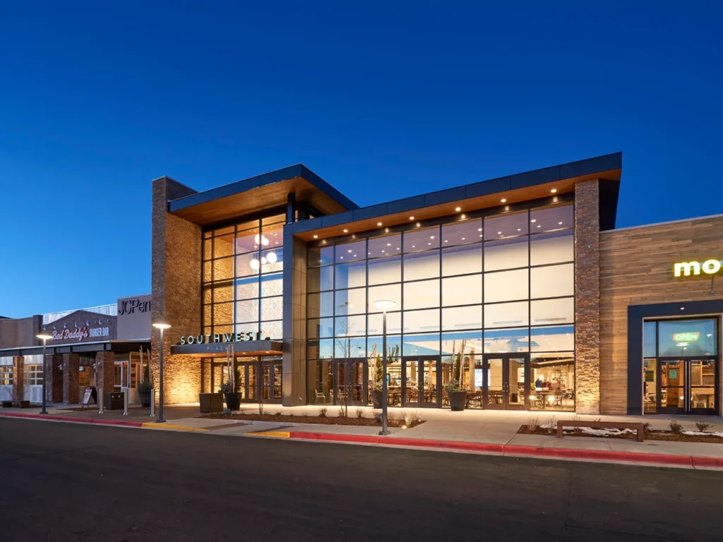 Aerial view of Southwest Plaza shopping center with various stores and parking lot.