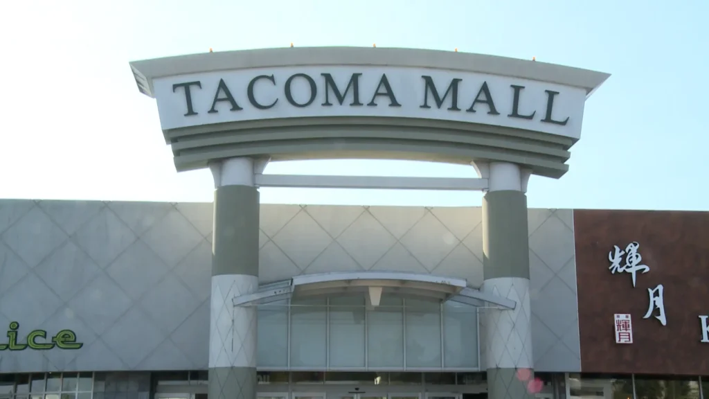 Exterior of Tacoma Mall, showcasing a large building with a prominent sign reading 'Tacoma Mall'.