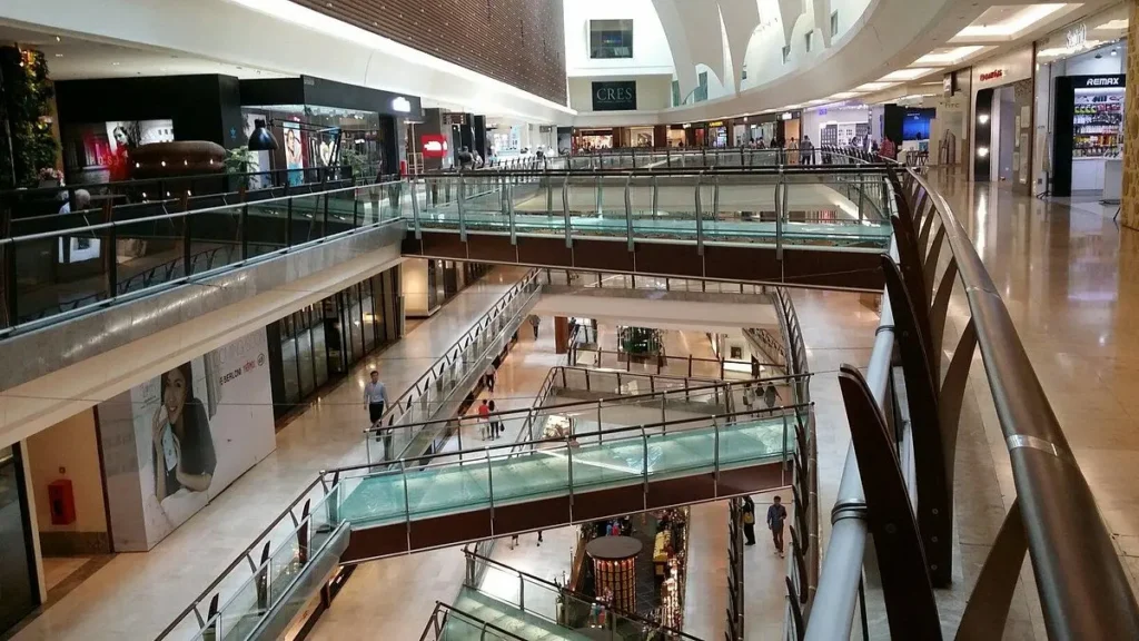 The Gardens Mall filled with people browsing stores.