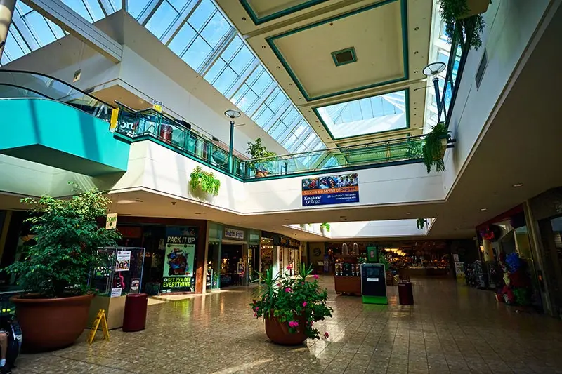 A bustling marketplace with shops and vendors at Steamtown