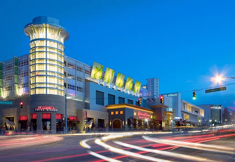 A bustling shopping mall with bright lights, stores galore, and happy shoppers. Towson Town Center is a retail paradise!