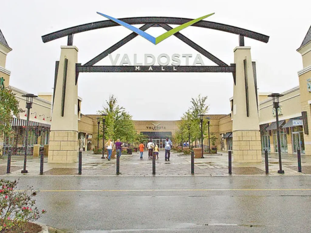 Entrance to Valdosta Mall with people walking in front.