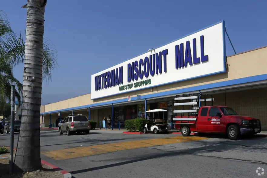 Waterman Discount Mall: A bustling shopping center with a wide variety of stores offering discounted prices.