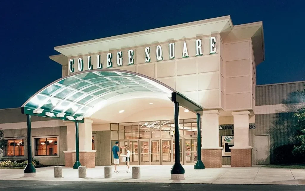 View of College Square Mall showcasing various stores and busy shoppers.