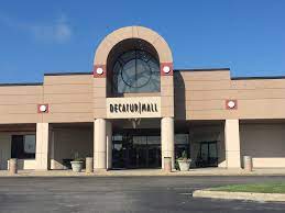 A large building with a sign that reads 'Decatur Mall'