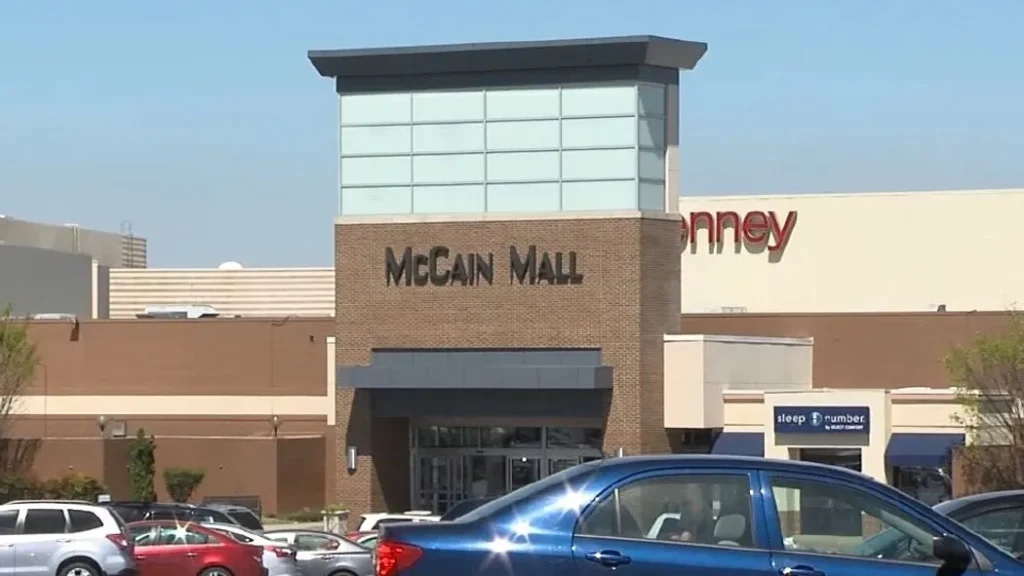 Step into a world of retail wonders at this shopping mall, where a charming clock graces the facade of a stunning building.