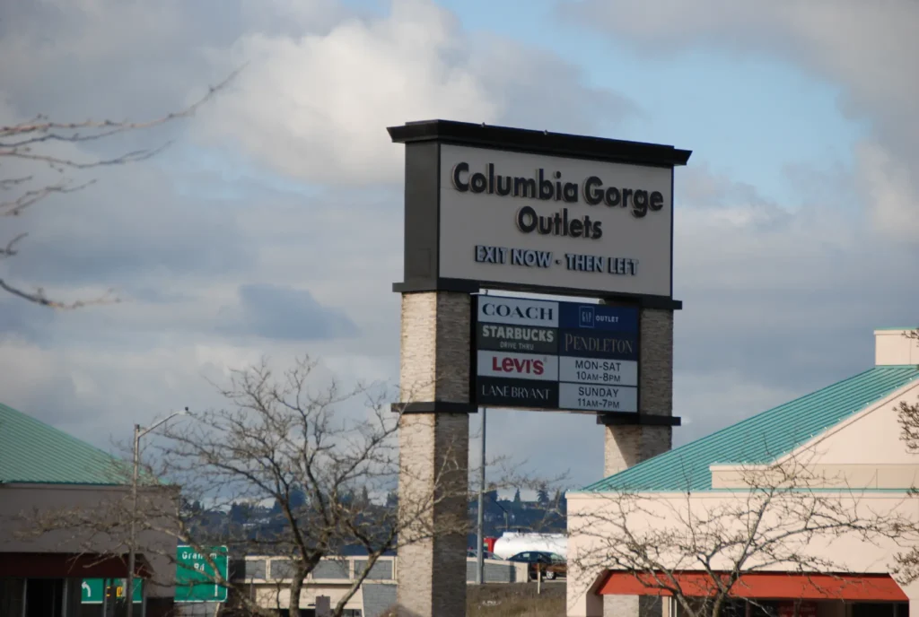 Sign for Columbia George's, featuring bold lettering and vibrant colors.