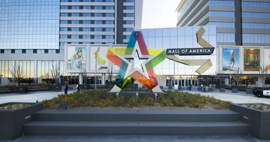 Star-shaped sculpture in front of building, symbolizing creativity and innovation.