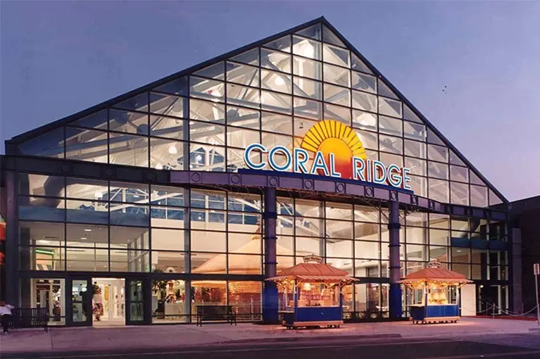 Front of a large building with a "Golf Galaxy" sign, offering golf equipment and accessories.