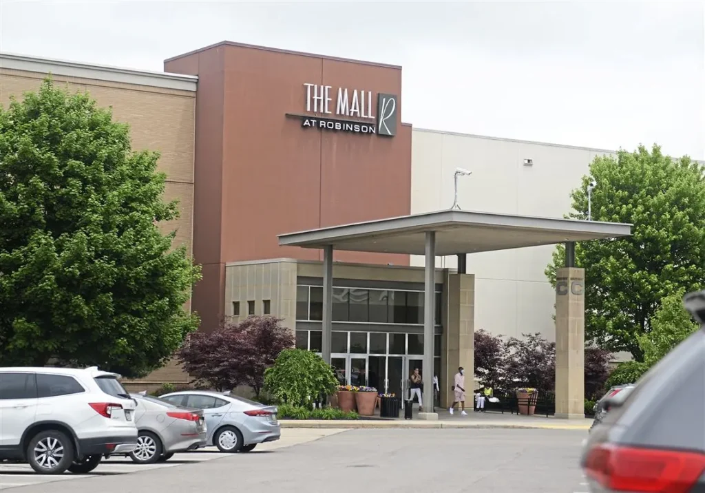 A bustling shopping center with a variety of stores, restaurants