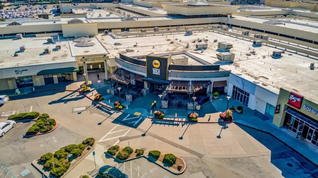 a shopping center with spacious parking lots.