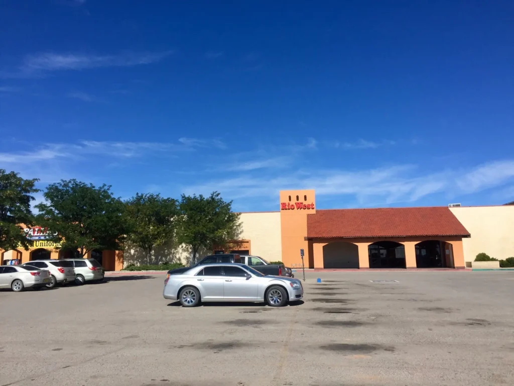 A bustling shopping center with a variety of stores, restaurants