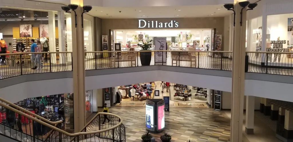 Entrance of Beachwood Place Mall with glass doors and a sign displaying the name.