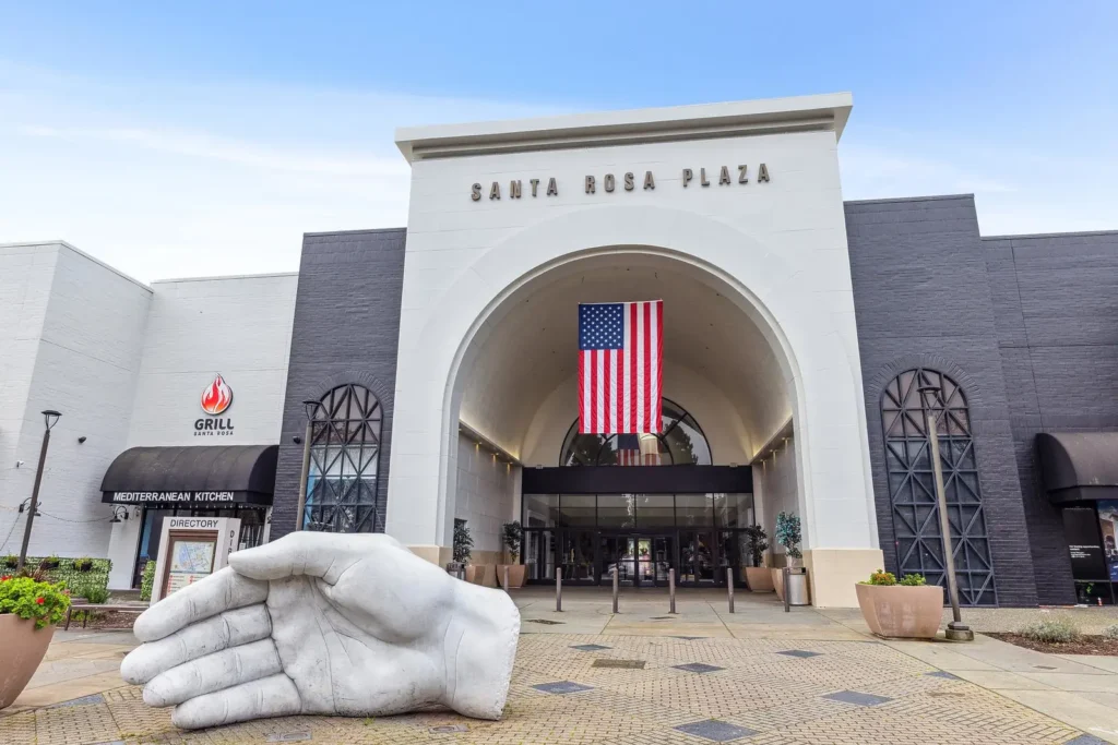 Sculpted hand statue in front of Santa Rosa Plaza Mall.