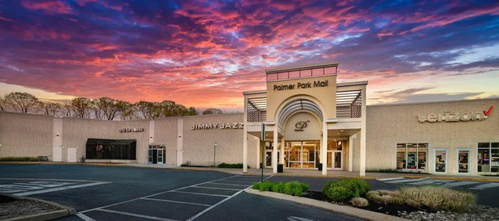 A bustling shopping center with various stores, restaurants