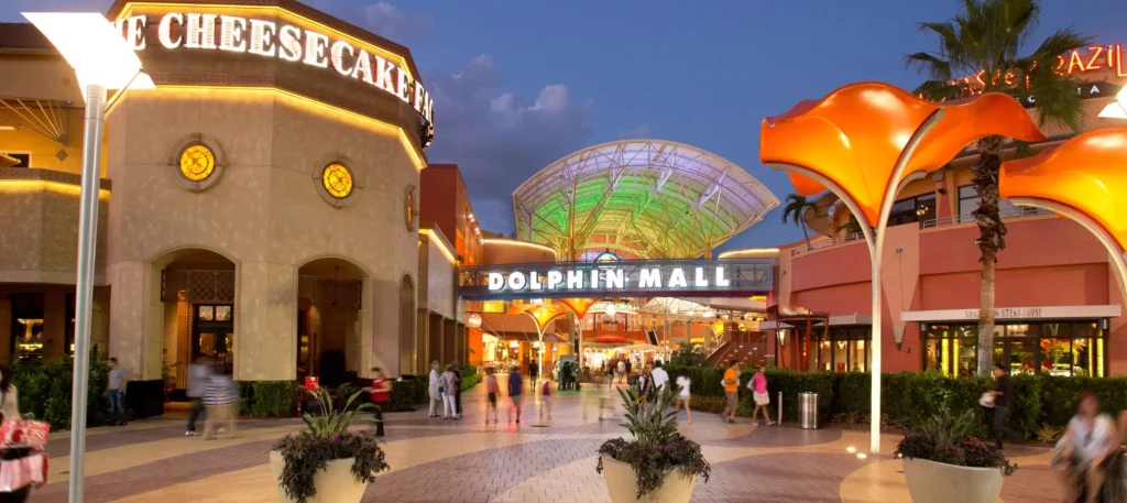 People walking around inside Dolphin Mall.