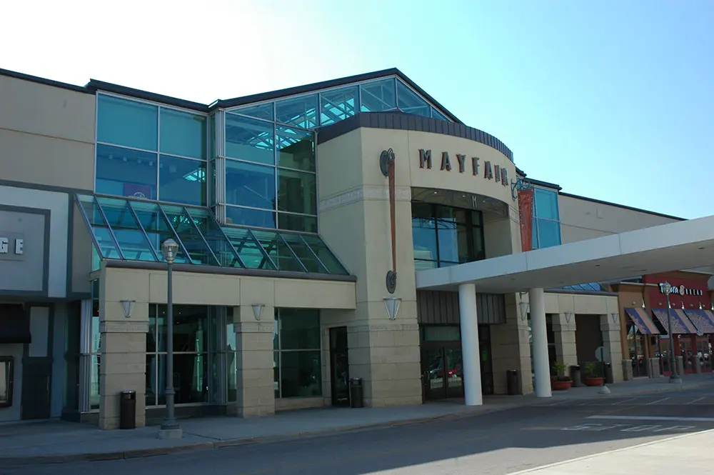 A Mayfair Mall building with a spacious glass front, showcasing.