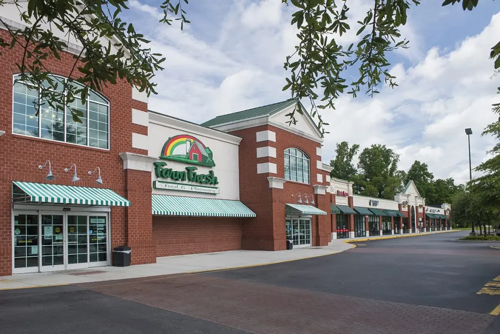 Brick building with green awning at Mount Pleasant Mall.