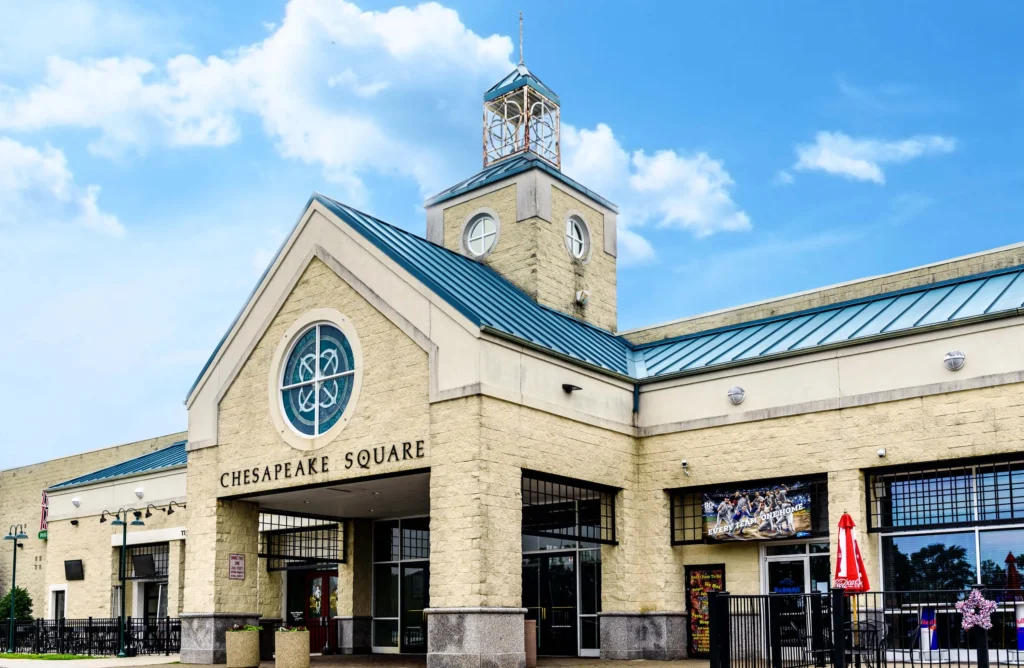 a bustling shopping center with various stores