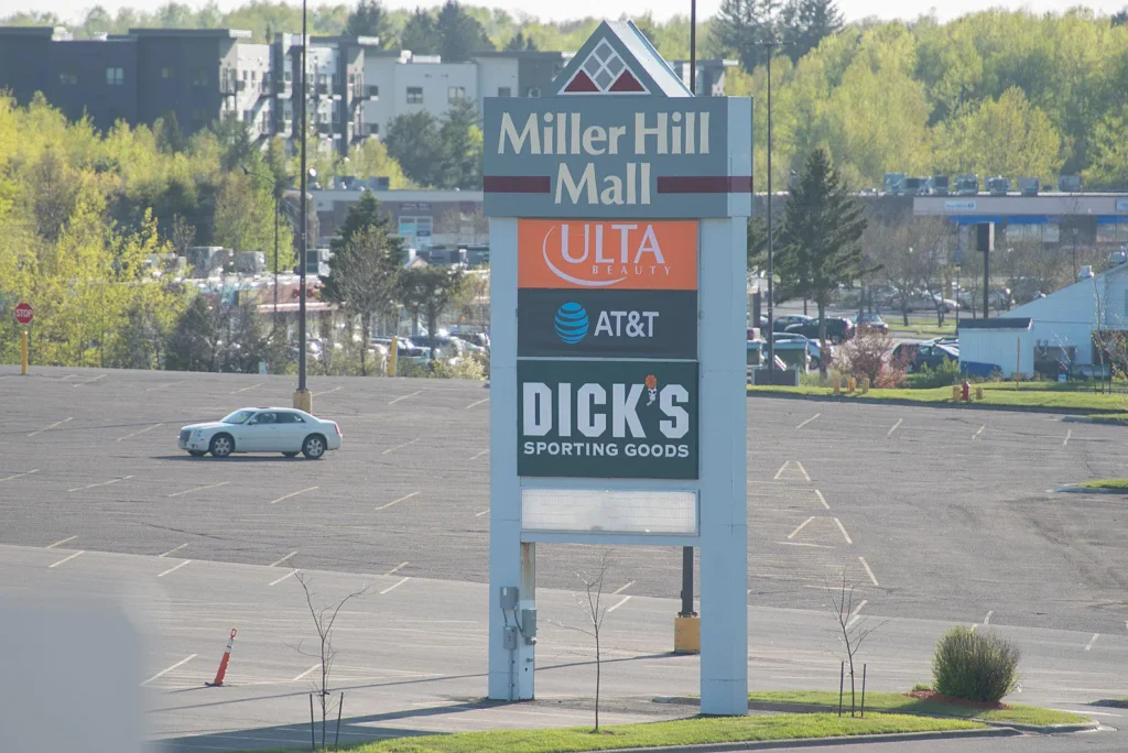 Exterior view of Miller Hill Mall with various stores and shoppers