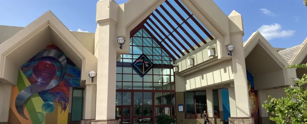 Port Charlotte Town Center Mall entrance featuring vibrant mural.