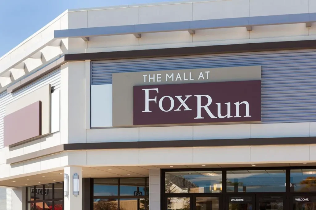 A bustling shopping mall with various stores, restaurants