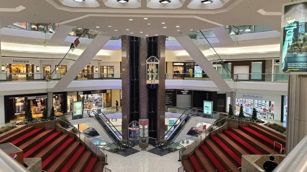 A bustling shopping destination with a variety of stores, restaurants