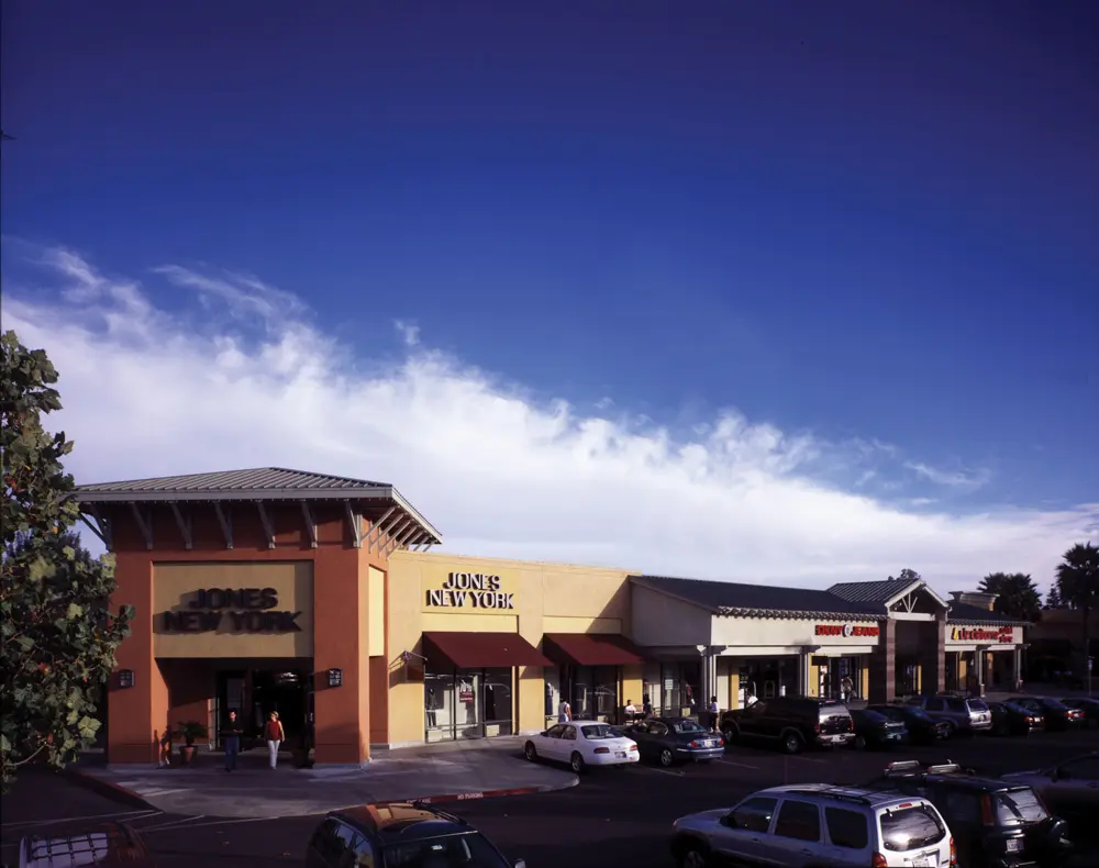 Cars parked in a parking lot at Napa Premium Outlets Mall.