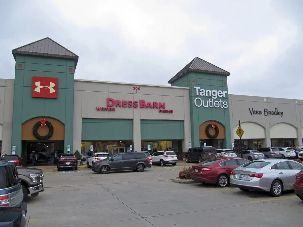 store front with a sign that says Tanger Outlets Branson Mall