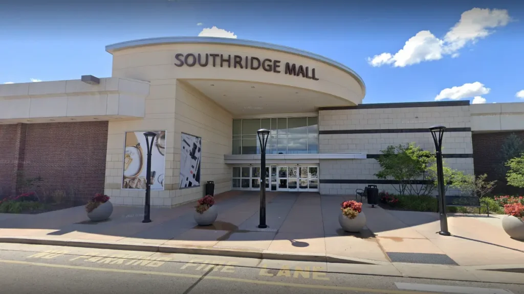 A bustling shopping center with a variety of stores, restaurants