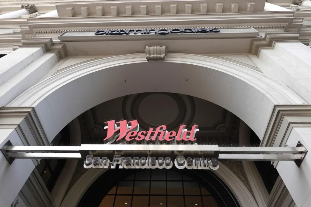 A sign reading 'Westfield' on a large archway at San Francisco Centre Mall.