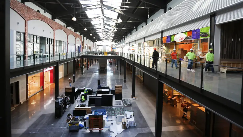 spacious indoor shopping complex filled with people