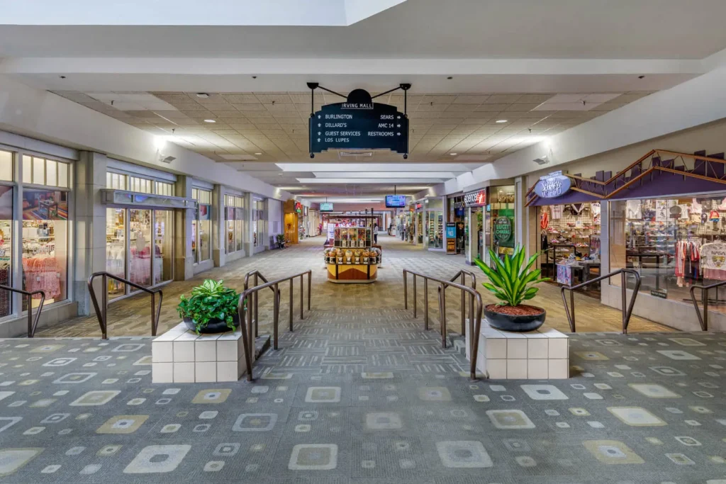 A mall with a large sign on the wall, displaying 'Irving Mall.